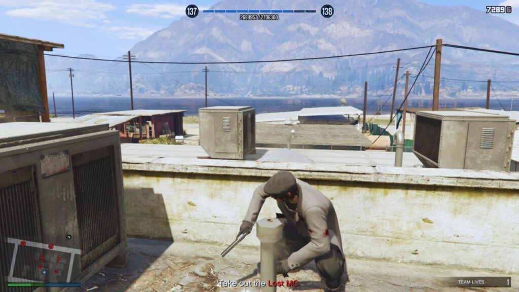 The GTA Online Protagonist taking cover at the balcony of Ace Liquor. 